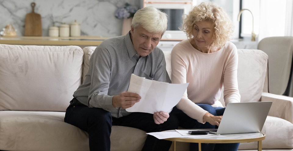 Retiree calculating Medicare premiums and IRMAA surcharge